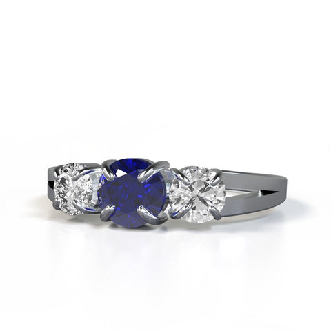 newton ring with blue sapphire and white diamonds in 14kt white gold